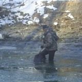 breaking ice to fish